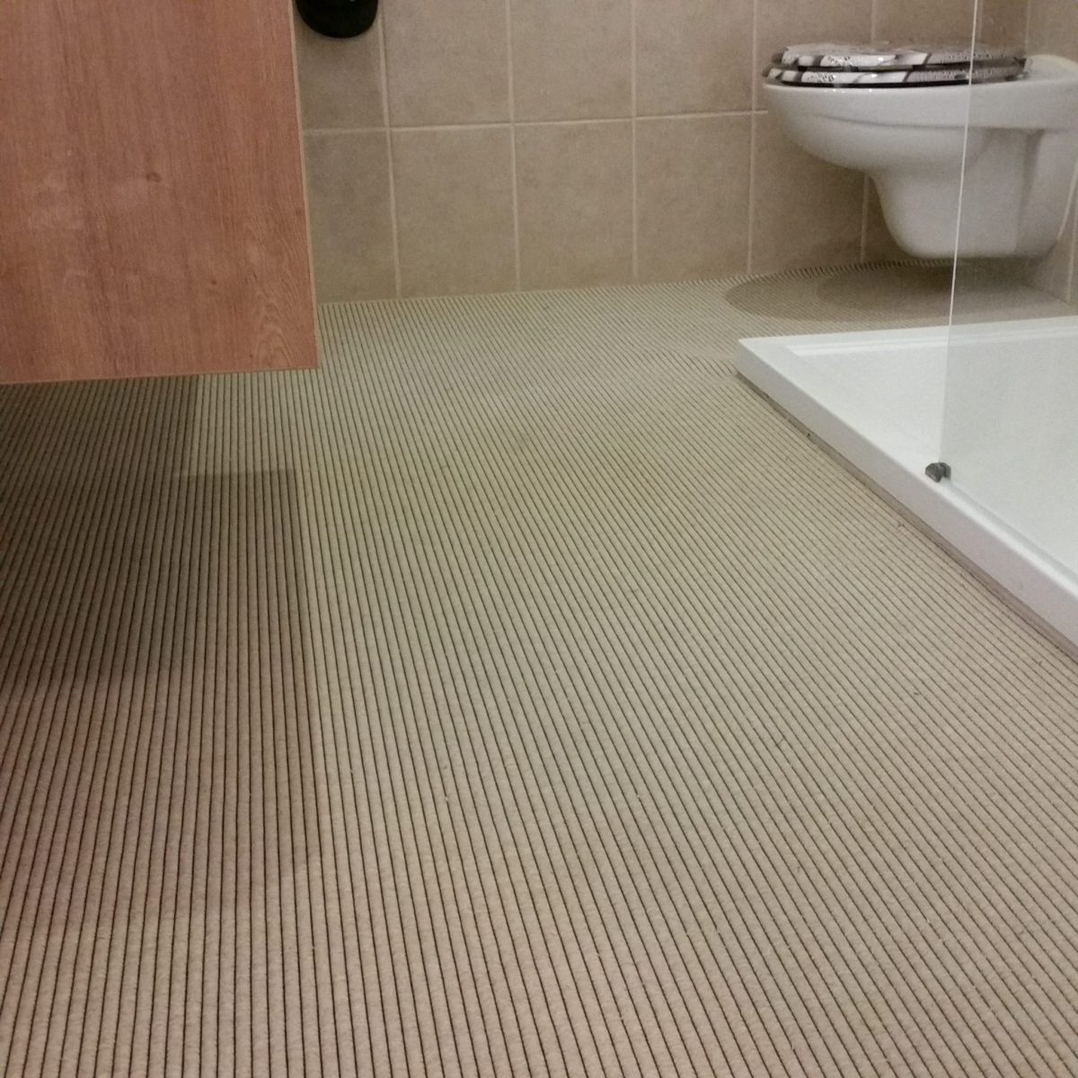 badkamer tapijt beige