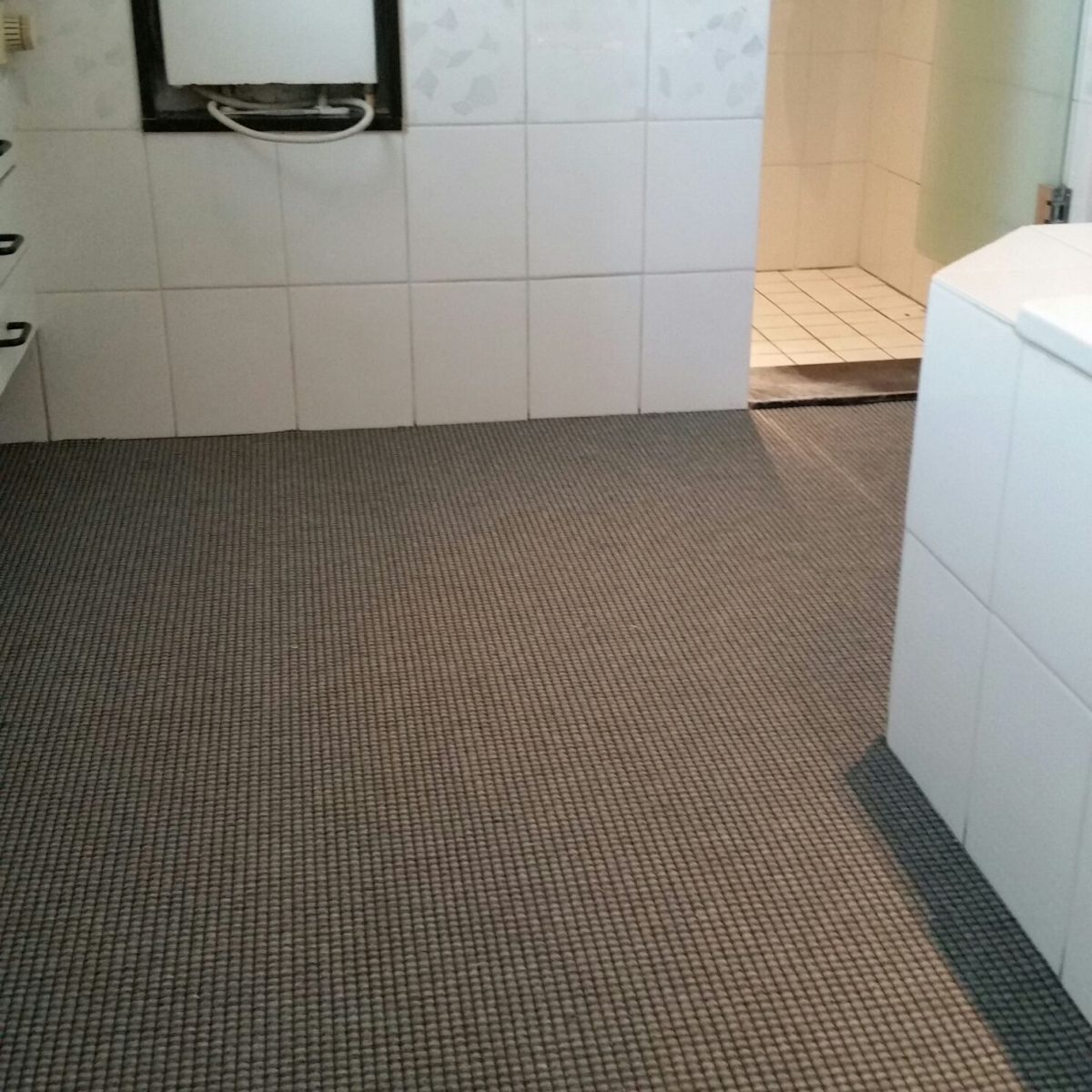 Badkamer tapijt zand